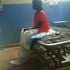 A patient at Lodwar County Referral Hospital on a bed without a mattress on August 28, 2022.