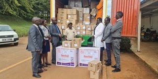 Elgeyo Marakwet Governor Wisley Rotich (in a blue tie) receives a consignment of drugs worth Sh7 million from KEMSA