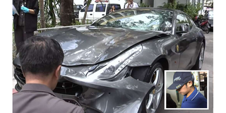 Police inspecting the Ferrari car belonging to Red Bull heir Vorayuth "Boss" Yoovidhya in Bangkok