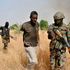 Nigerian soldiers capture a terrorist after an operation against Boko Haram terrorists.
