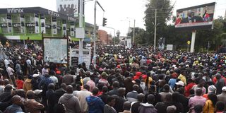 Members of the public following live Supreme Court proceedings on a public screen in Eldoret town on September 5, 2022.