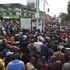 Members of the public following live Supreme Court proceedings on a public screen in Eldoret town on September 5, 2022.