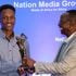 NMG Chairman Dr Wilfred Kiboro awards fifth leg winner Kevin Kabugi