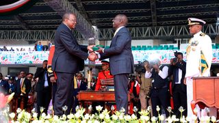 President William Ruto is handed the instruments of power by his predecessor Uhuru Kenyatta.