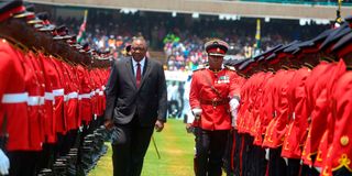 Former President Uhuru Kenyatta inspecting a guard of honour mounted by the Kenya Defence Forces