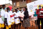 Health PS Susan Mochache distributing sanitary pads to girls at Mathare Youth Sports Association Grounds