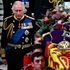 Britain's King Charles III walks beside the coffin of Queen Elizabeth II.