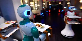 Robot waiters deliver food to customers