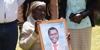 Esther Chirchir, mother of the late William Chepkut, former Ainabkoi MP, family members and other mourners 