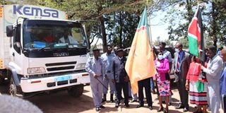 Trans Nzoia Health CEC Ms Claire Wanyama flagging off drugs and non-pharmaceuticals worth Sh51 million from Kemsa