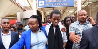 Diana Chepkemoi being held by former Nairobi County CEC Vesca Kangongo at Jomo Kenyatta International Airport.