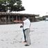 One of the Amani Tiwi Beach hotel managers shows the deserted beachfront of the hotel