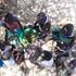 A woman and children eat wild leaves in Kanamkuny village in Turkana County 