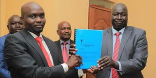 Elgeyo Marakwet Governor Wisley Rotich (left) receives a task force report on the proposed Kerio Valley university 