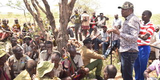 Samburu Governor Jonathan Lelelit speaks to a group of Turkana herders during a peace meeting in Charda area, Samburu North