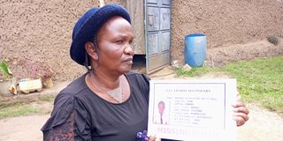 Gone without a trace: Mrs. Susan Wangeci holding a poster of her missing grandchild-Shakilla Kangethe Munyaka