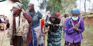 Elderly women after receiving relief food disbursed by the government 