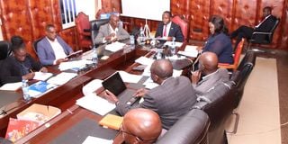 Governor George Natembeya (centre) and his deputy Philomena Bineah Kapkor meeting pending bills team