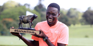 Zimbabwe's Nyasha Muyambo poses with the trophy