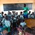 A teacher with his pupils in Turkana County.