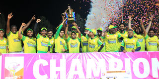 Mafuko Mavericks players celebrate with the trophy 