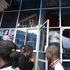 Members of the public outside Saito Centre building in Eldoret town, Uasin Gishu County with broken window panes