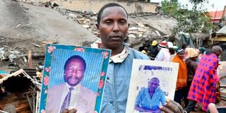 Patrick Karomo’s brother Fredrick Kamau displays the photos of their parents, Peter Njuthi and Faith Wambui