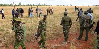 Police try to stop members of the Sirikwa Squatters Group 