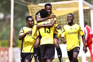 Tusker striker Deogratious Ojok celebrates with teammates 