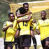 Tusker striker Deogratious Ojok celebrates with teammates 