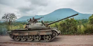 A Congolese army tank heads towards the front line against M23