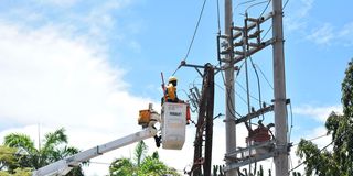 Kenya Power personnel from the Live Line Team attend to a power issue at Pandya Hospital
