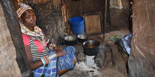 A Samburu woman in her house (manyatta) at Laresoro area in Samburu East