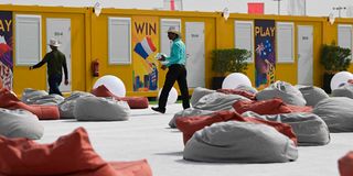 Employees prepares cabins at the Al-Emadi fan village in Doha