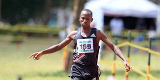 Isaiah Lasoi wins the senior men's 10 kilometres race