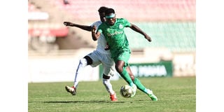 Gor Mahia forward Benson Omalla (right) vies for the ball with Kariobangi Sharks defender Luke Kevin