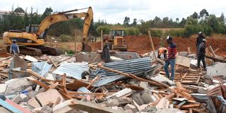 Members of the public salvage what they could after houses were demolished at Kapseret in Uasin Gishu County