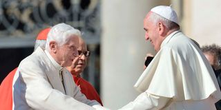 Pope Benedict and Pope Francis.