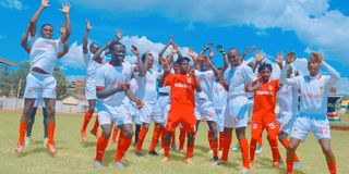 Shabana players celebrate after being presented with a new playing kit