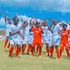 Shabana players celebrate after being presented with a new playing kit