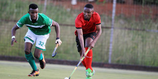 Euller Natombe (right) of Parkroad Badgers dribbles past Chris Ngatia of Greensharks