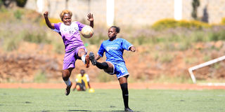 Lavender Akeyo (right) of Zetech Sparks vies for the ball with Lavine Achola of Gaspo 