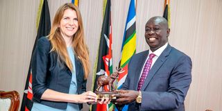 Deputy President Rigathi Gachagua hands a gift to UK High Commissioner to Kenya Jane Marriott