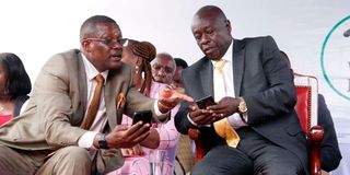 Deputy President Rigathi Gachagua and ICT Cabinet Secretary Eliud Owalo check internet connectivity