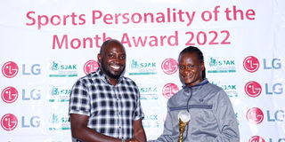 Boxer Sarah Achieng (right) receives her trophy from LG content manager William Kamore