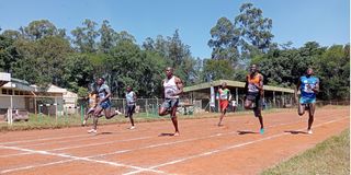 Athletes compete in men's 200 metres race during Athletics Kenya sprints, middle distance and field events at Mumias 