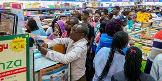Parents and guardians shop for textbooks and other school items for their children at Savanis bookshop 