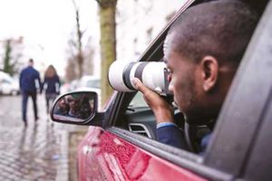 A private detective spying on cheating spouse. 