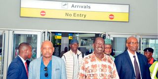 Azimio leader Raila Odinga and charges D' Affairs Kenya High Commission to Nigeria, Amb. Samuel Mogere