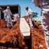 Municipal Johannesburg Morgue workers bury the coffin of an unidentified body